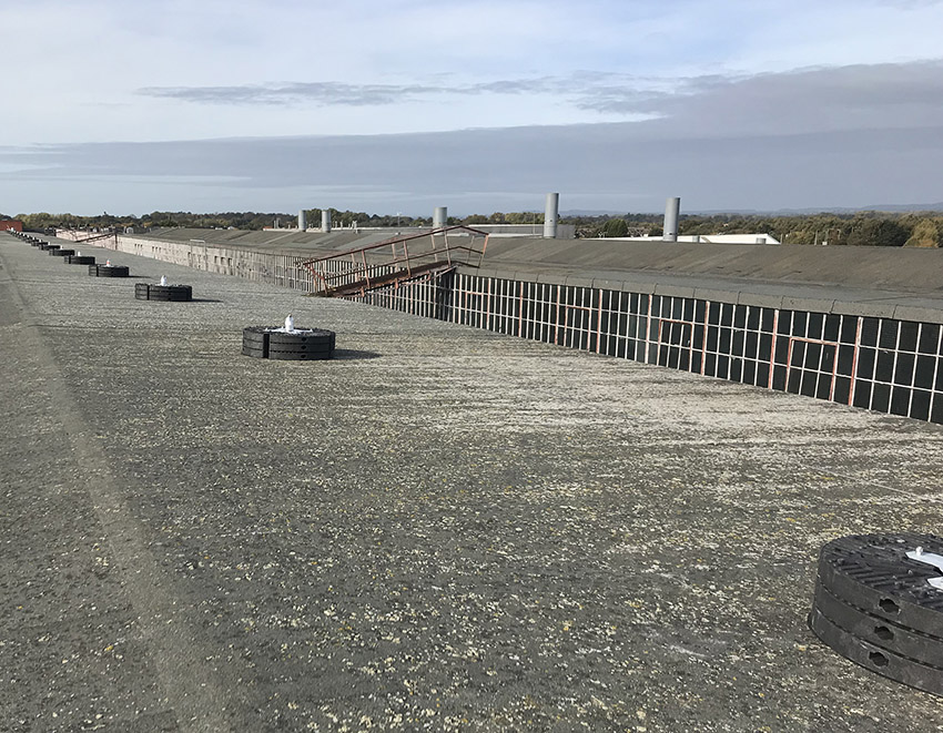 Weighted anchor systems providing fall protection without roof penetration